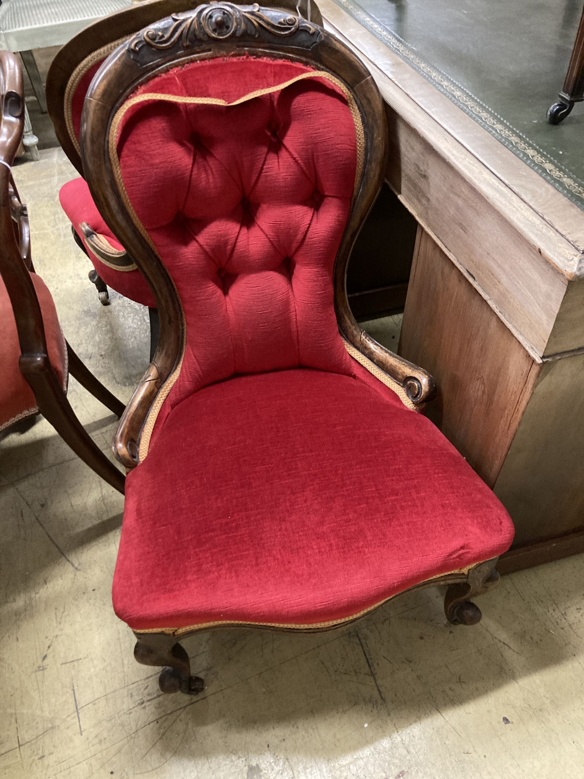 Two Victorian mahogany spoon back nursing chairs